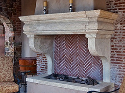 a 15th century antique stone surround with overmantle